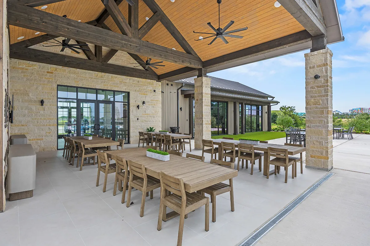 Covered seating and outdoor gathering area at the East Village amenity center