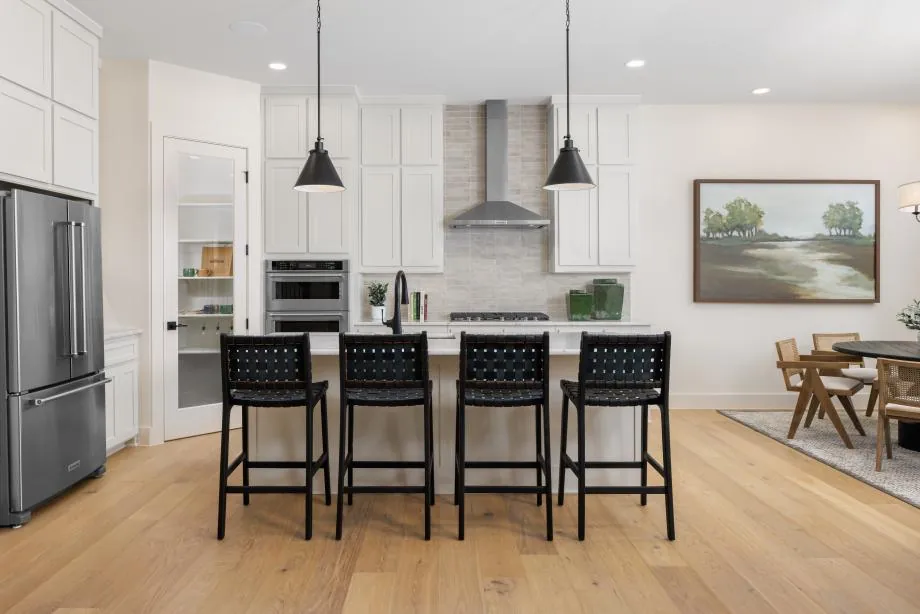 Kitchen and dining area in the Toll Brothers Corby model at The Ranch at Uptown Celina