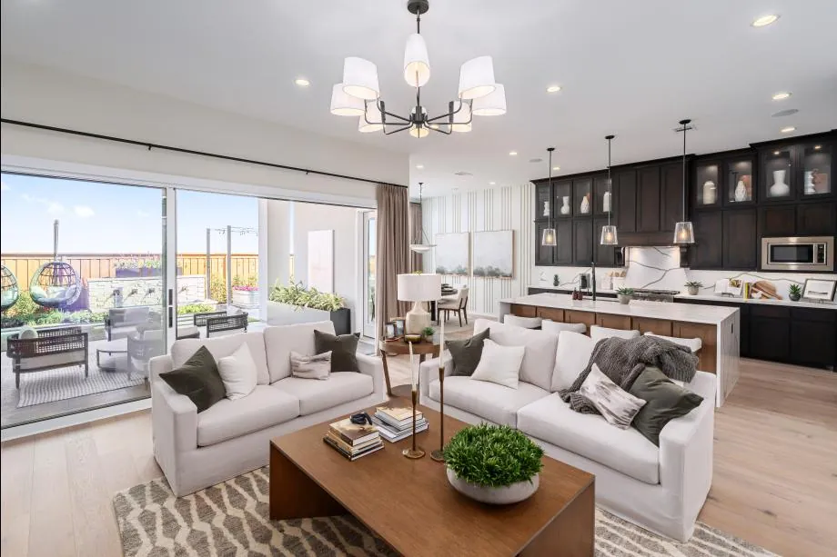 Great room and open kitchen in Toll Brothers’ Neches model in Fields Woodlands Collection