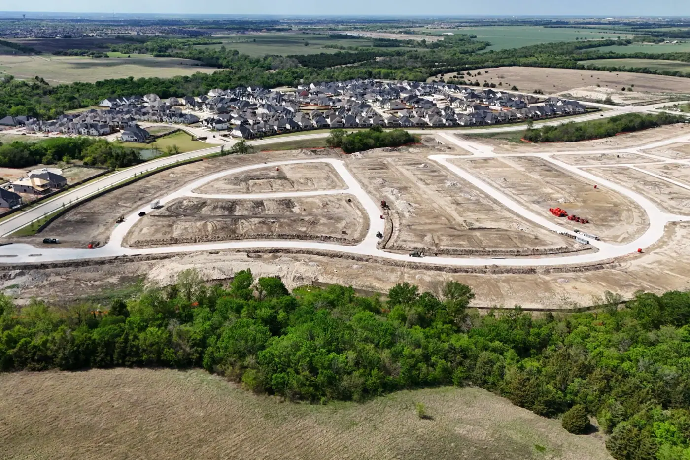 Aerial view of homes and developing streets in Aster Park from M/I Homes