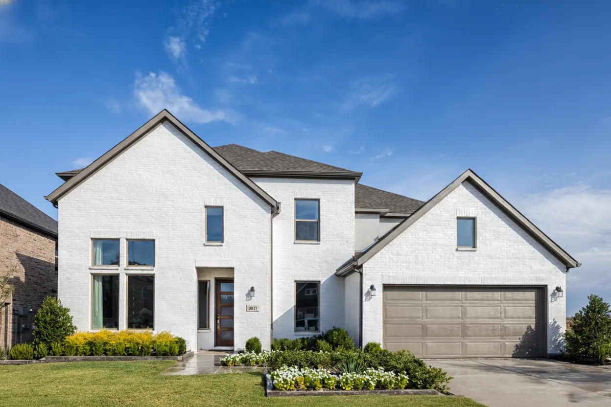 Taylor Morrison model-home exterior pictured for Highland Lakes 60s in McKinney