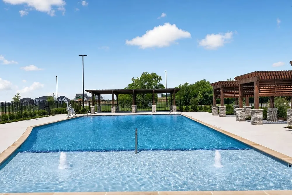Community pool and shaded seating at The Ranch at Uptown Celina