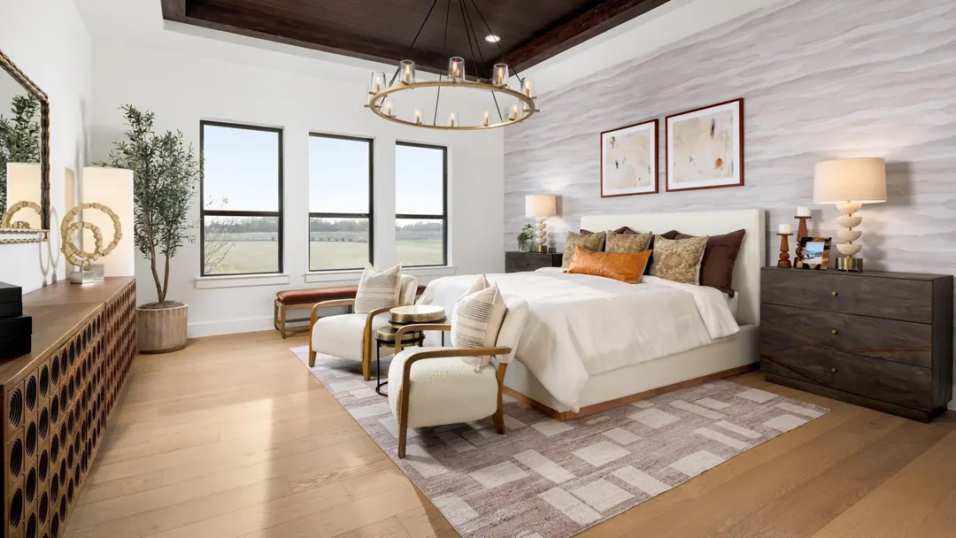 Primary bedroom in the Henson Farmhouse model at Ridge Pointe Estates