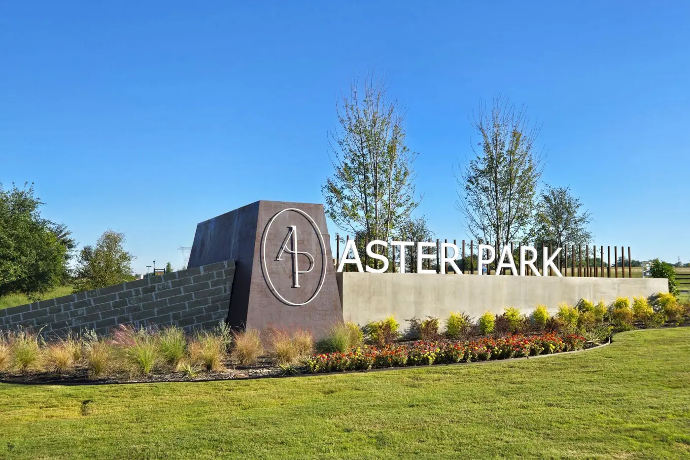 Aster Park entrance monument and landscaping pictured by M/I Homes